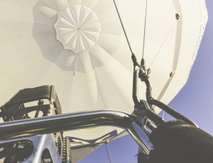 white hot air balloon under blue sky thumbnail